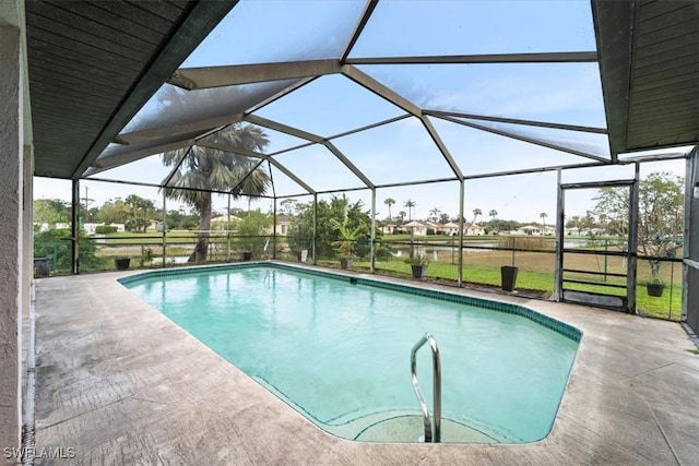 outdoor pool featuring a lanai and a patio area