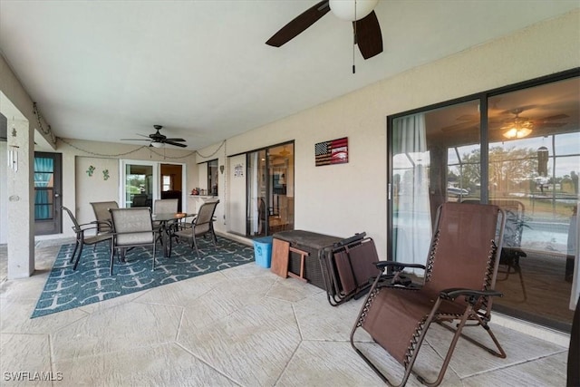 sunroom with a ceiling fan