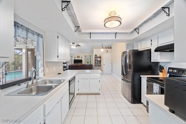 kitchen with light tile patterned floors, black / electric stove, under cabinet range hood, a sink, and dishwasher