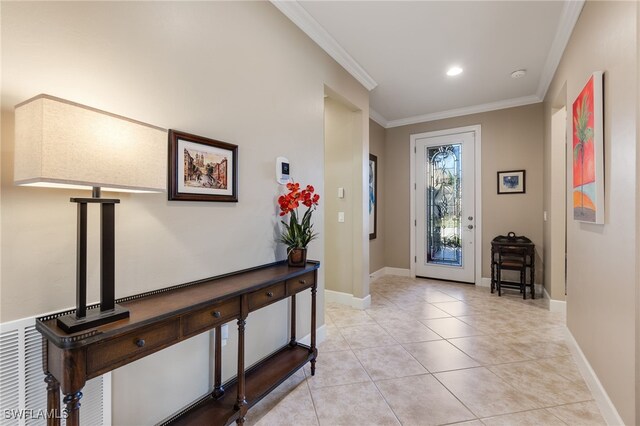 entryway with light tile patterned floors, recessed lighting, baseboards, and ornamental molding