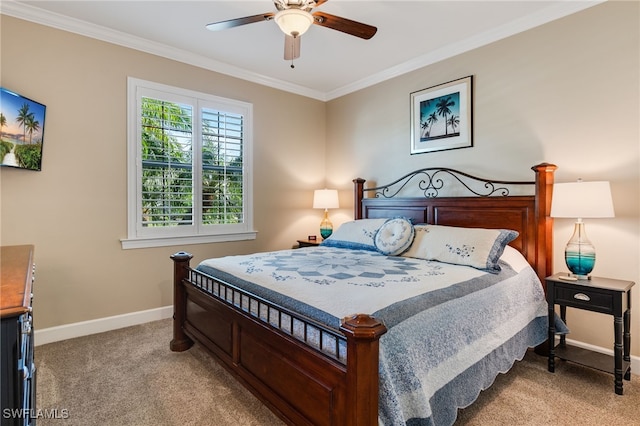 bedroom featuring carpet floors, ceiling fan, baseboards, and ornamental molding