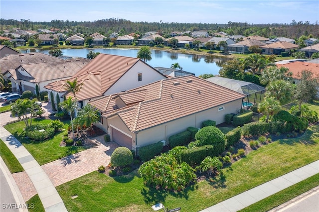 bird's eye view featuring a residential view and a water view