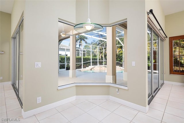 doorway featuring tile patterned floors and a healthy amount of sunlight