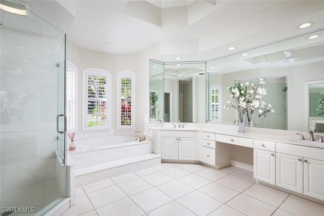 bathroom featuring a garden tub, a stall shower, recessed lighting, tile patterned flooring, and vanity