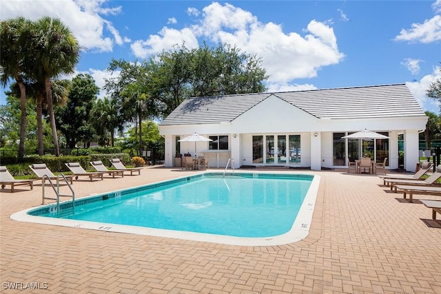 pool featuring a patio and fence