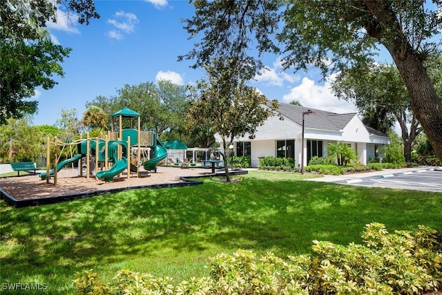 community play area featuring a lawn