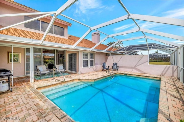 11596 Quail Village Way, Naples, FL 34119 - swimming pool with a patio area, glass enclosure, and area for grilling