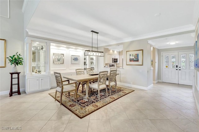 11596 Quail Village Way, Naples, FL 34119 - dining area featuring ornamental molding, light tile patterned floors, and baseboards