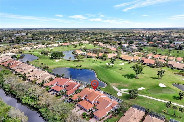 birds eye view of property with a residential view, view of golf course, and a water view