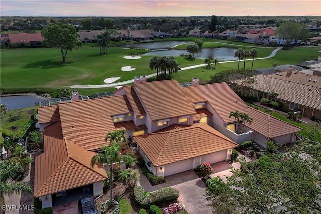 bird's eye view with a water view, a residential view, and golf course view