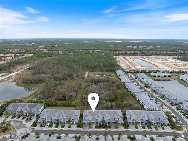 aerial view with a residential view and a water view