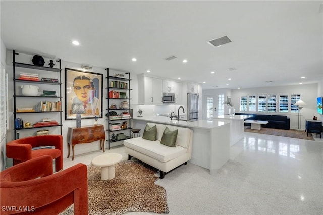 living room with visible vents and recessed lighting