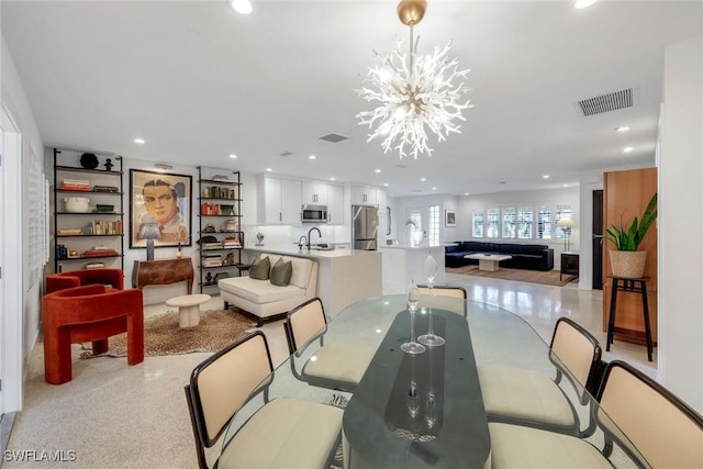 dining room with recessed lighting, visible vents, and a notable chandelier