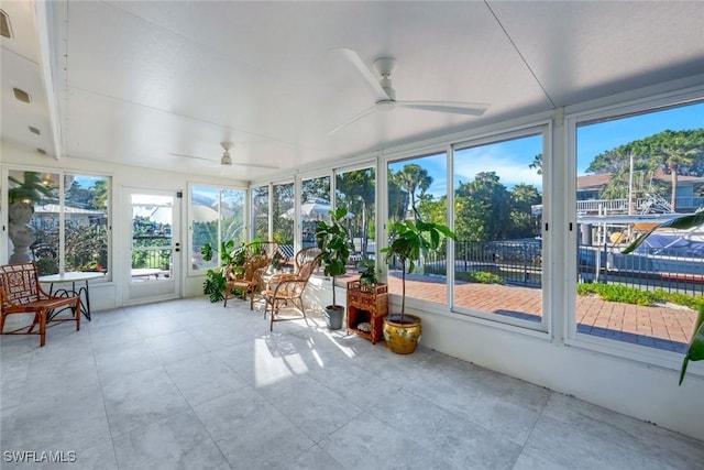 sunroom with a ceiling fan