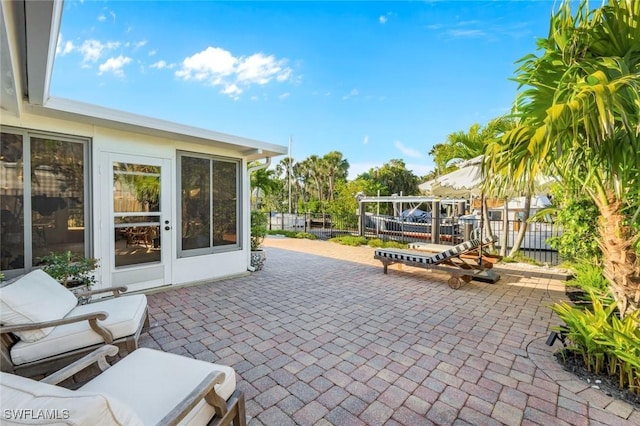 view of patio featuring fence