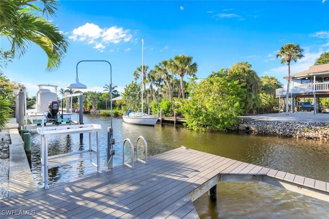 view of dock featuring a water view and boat lift