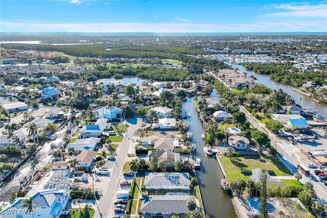 bird's eye view featuring a residential view and a water view