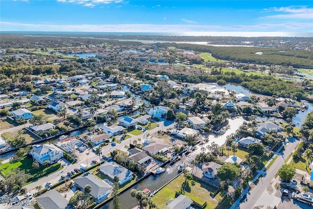drone / aerial view featuring a water view and a residential view