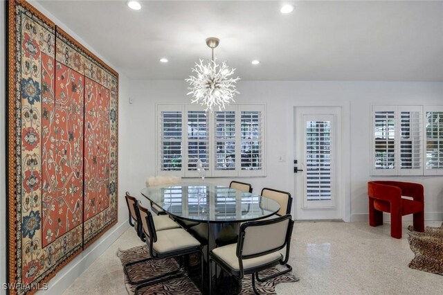 dining area with baseboards, an inviting chandelier, carpet flooring, and recessed lighting