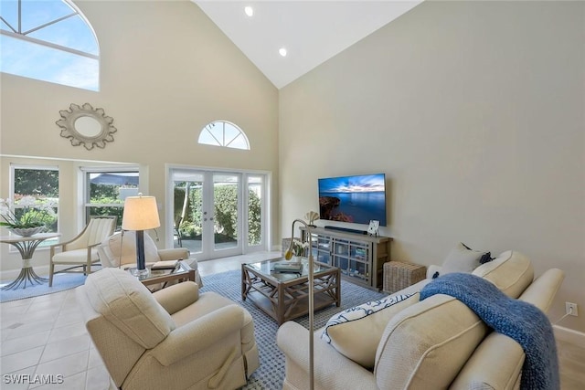 living room with high vaulted ceiling, recessed lighting, french doors, and light tile patterned floors