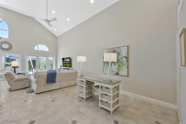 living area with light tile patterned floors, baseboards, a ceiling fan, french doors, and high vaulted ceiling