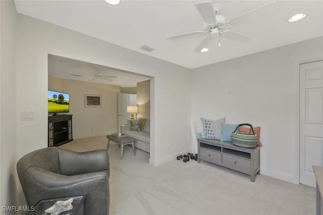 sitting room with recessed lighting, visible vents, light carpet, ceiling fan, and baseboards