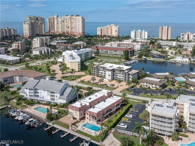 bird's eye view featuring a water view and a city view