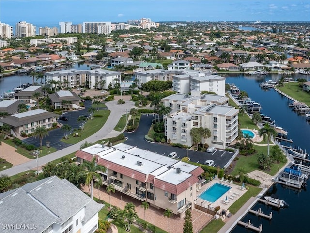 bird's eye view featuring a view of city and a water view