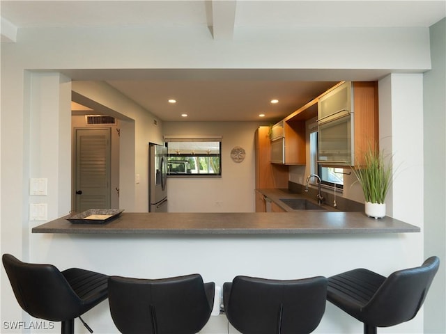 kitchen featuring recessed lighting, a sink, visible vents, a healthy amount of sunlight, and appliances with stainless steel finishes