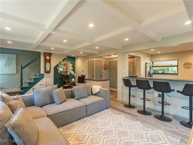 living room with recessed lighting, wood finished floors, beam ceiling, and stairs