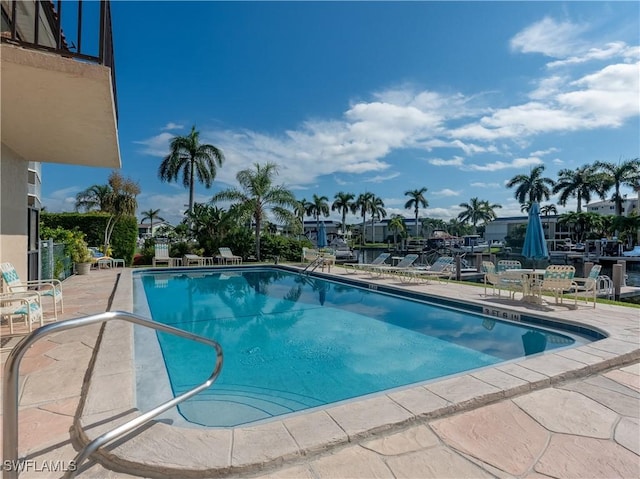 community pool featuring a patio area