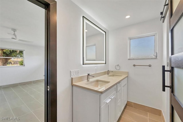 2501 Rio Grande Dr, Punta Gorda, FL 33950 - bathroom featuring tile patterned floors, recessed lighting, ceiling fan, and a sink