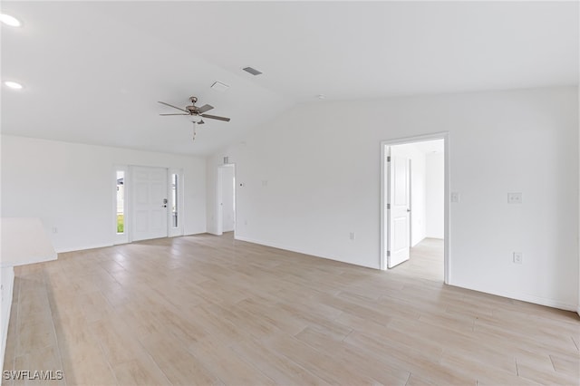 unfurnished living room with lofted ceiling, visible vents, a ceiling fan, and light wood-style floors