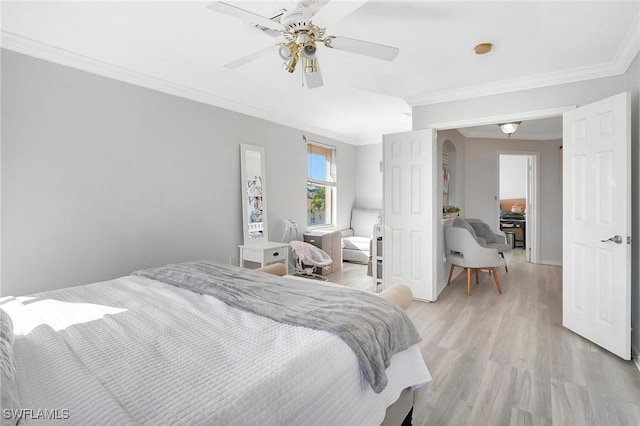 bedroom featuring light wood-type flooring, baseboards, ornamental molding, and a ceiling fan