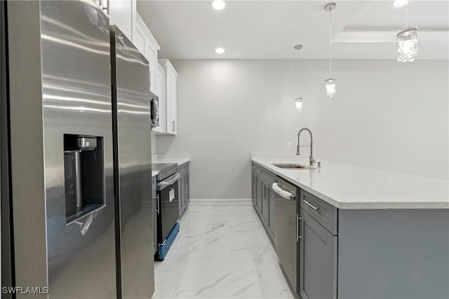 kitchen with appliances with stainless steel finishes, a peninsula, marble finish floor, gray cabinets, and a sink