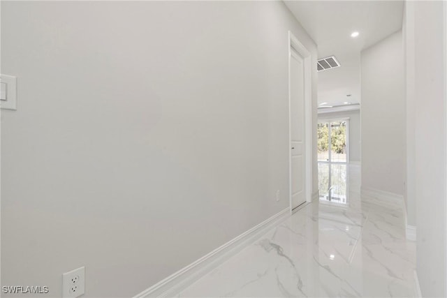 hall with marble finish floor, visible vents, baseboards, and recessed lighting