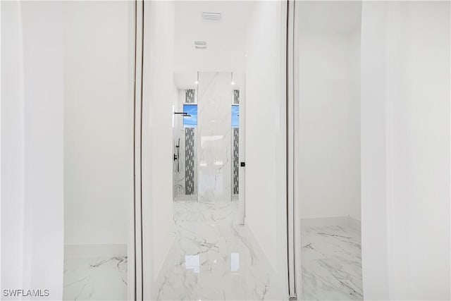 bathroom featuring marble finish floor