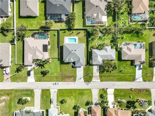 birds eye view of property with a residential view