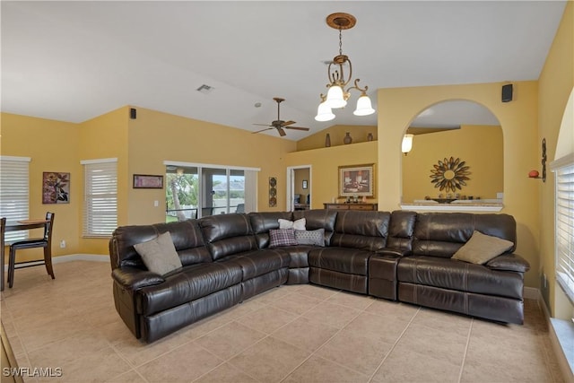 living room with lofted ceiling, visible vents, baseboards, and light tile patterned floors