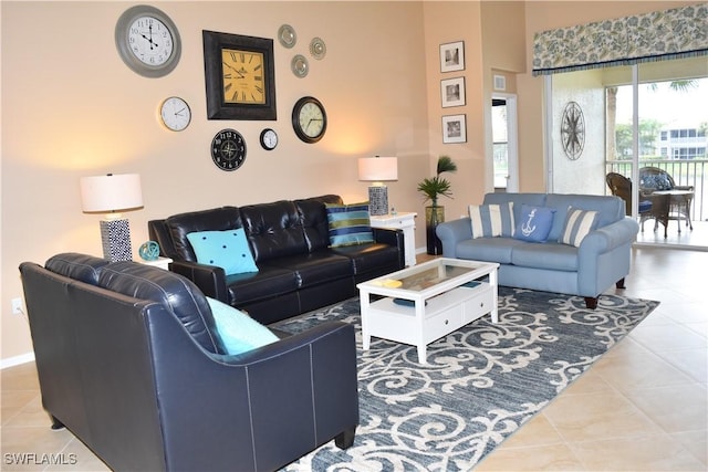 living area featuring baseboards and tile patterned floors