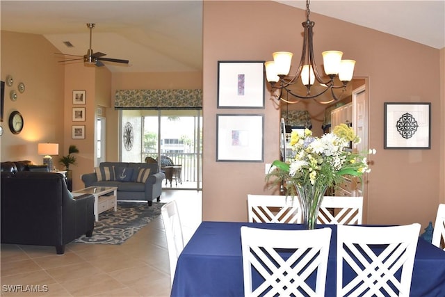 dining room featuring high vaulted ceiling, ceiling fan with notable chandelier, and light tile patterned floors