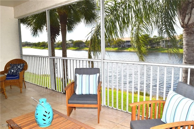 sunroom / solarium with a water view