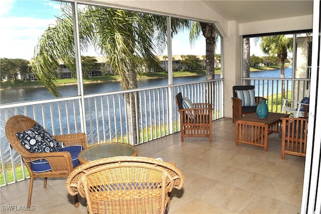 sunroom / solarium featuring a water view and a wealth of natural light