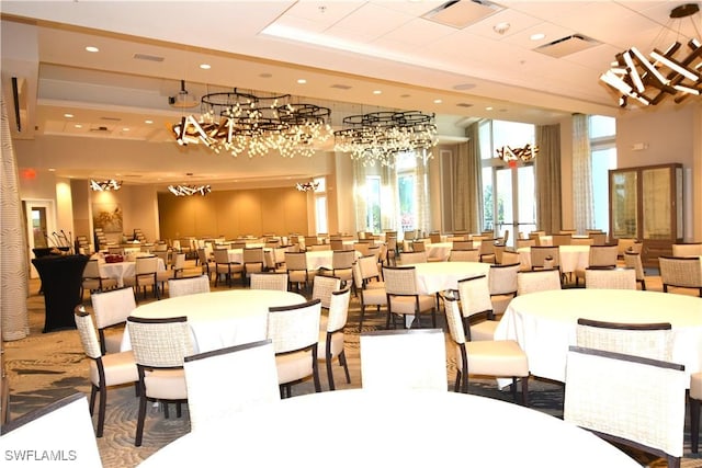 dining space featuring visible vents, a tray ceiling, and recessed lighting