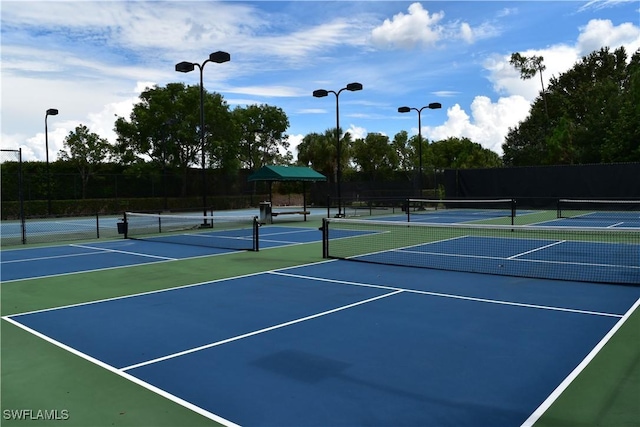 view of sport court with fence