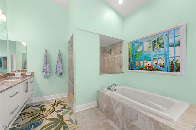 full bathroom featuring a walk in shower, a garden tub, vanity, baseboards, and tile patterned floors