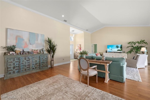 living room with lofted ceiling, baseboards, wood finished floors, and crown molding