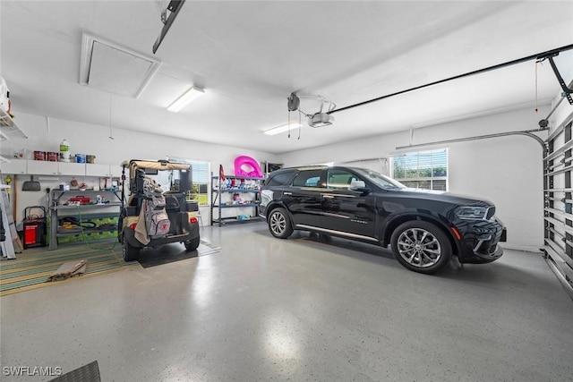 garage featuring a garage door opener