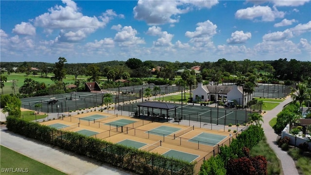 view of sport court featuring fence