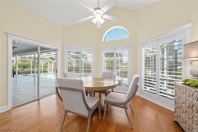 sunroom featuring ceiling fan